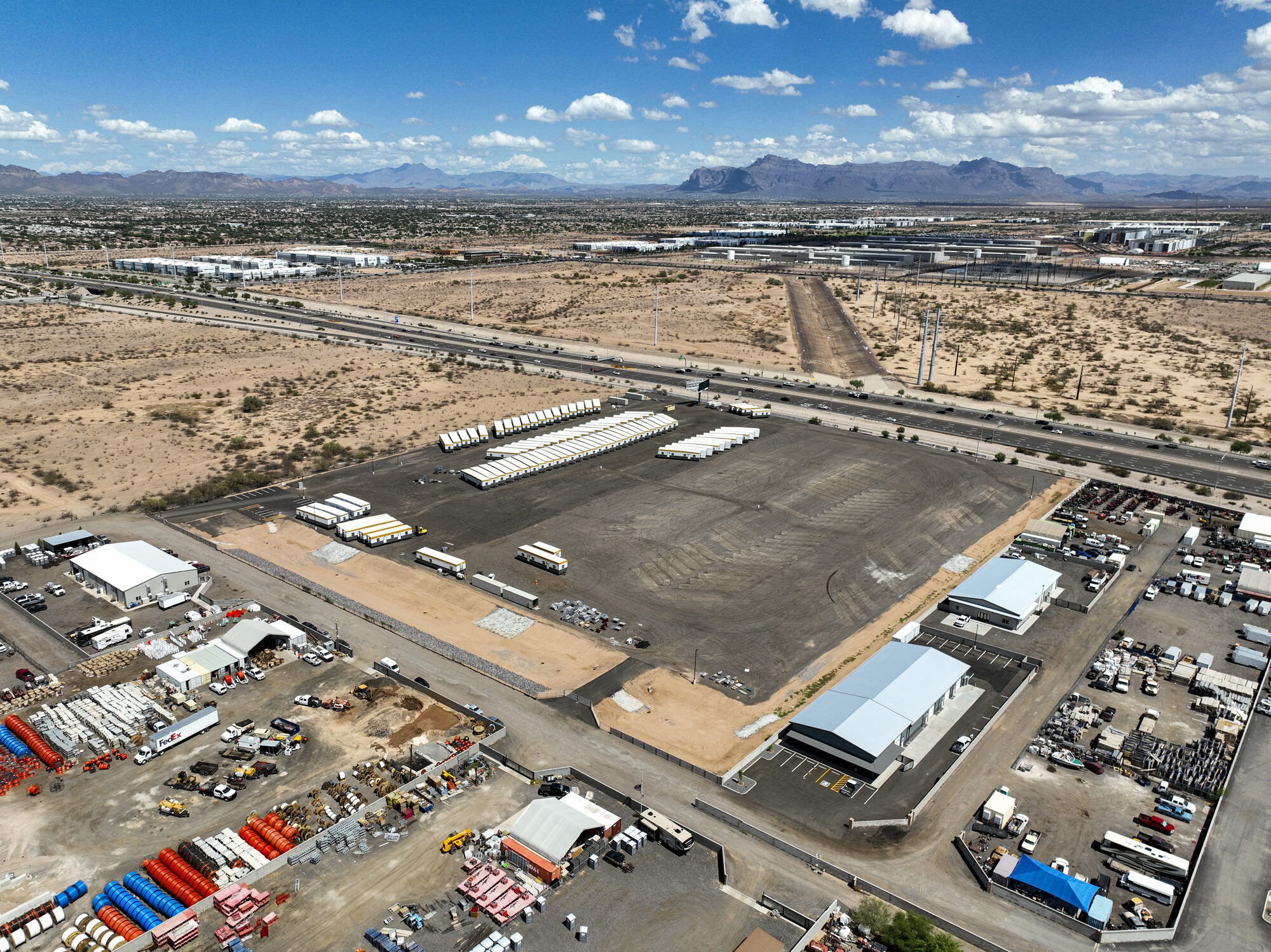 Aerial view of the paved trailer yard and industrial buildings at 11623 South 202nd Street, Mesa, Arizona